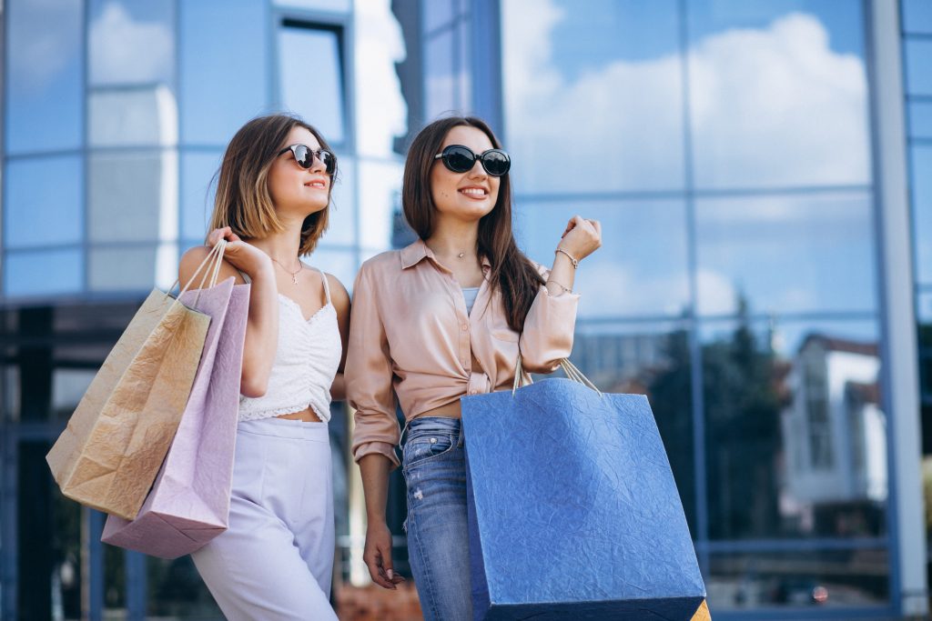 two women shopping, two attractive women shopping, stitch fix customer, stitch fix client, shopping, women shopping, colorful shopping bags
