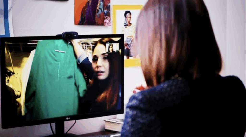 A busy corporate professional receiving styled outfits for work or travel from a virtual stylist.